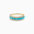The 14K Yellow Gold Turquoise and Diamond Wedding Band showcases a central row of turquoise beads bordered by sparkling white diamonds, photographed on a white background.