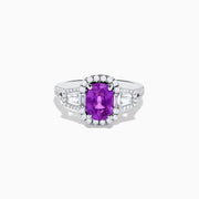 The Effy Hematian 18K White Gold Purple Sapphire and Diamond Ring showcases a large oval purple sapphire encircled by a diamond halo, with extra diamonds accenting the split shank, all set against a white background.