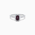 The Effy Hematian 14K White Gold Ring features a cushion-cut alexandrite center stone, surrounded by a diamond halo and additional diamonds set along the band.