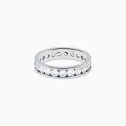 The 14K White Gold Channel Set Diamond Eternity Band, 2.00 TCW, showcases a continuous row of round diamonds set in white gold, elegantly displayed on a plain white background.