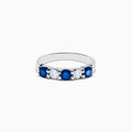 The 14K White Gold Blue Sapphire and Diamond Ring, 1.14 TCW, showcases three round blue sapphires and two round diamonds set alternately across the band against a plain white background.