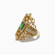 The Brasilica 14K Yellow Gold Emerald and Diamond Ring, 1.68 TCW, features a central rectangular emerald, diamond accents, and intricate filigree detailing for an elegant and elaborate design.