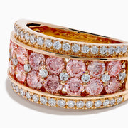 The Lab Grown Pink and White Diamond Statement Ring in 14K Rose Gold features a wide band with two rows of lab grown white diamonds on the edges and a central line of closely set pink diamonds for an elegant, eye-catching look.