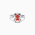 The Lab Grown Pink and White Diamond Halo Ring in 14K White Gold features a rectangular pink gemstone, a halo of lab grown diamonds, and a diamond-studded band, elegantly showcased on a white background.