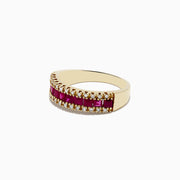 The Ruby Royal 14K Yellow Gold Princess Cut Ruby Band, 1.46 TCW, showcases a central row of princess cut rubies flanked by round white diamonds on each side, creating an elegant and symmetrical polished design.