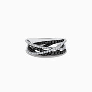 A 14K White Gold Black and White Diamond Ring (.72 TCW) with intertwined bands—one adorned with black diamonds, the other with white stones—displayed against a plain white background.