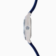 A modern 42MM Swiss Made Titanium Automatic Skeleton Watch with a blue strap, silver geometric case, and skeleton dial revealing intricate gears. Blue and silver hands complete this stylish Effy Watches timepiece.
