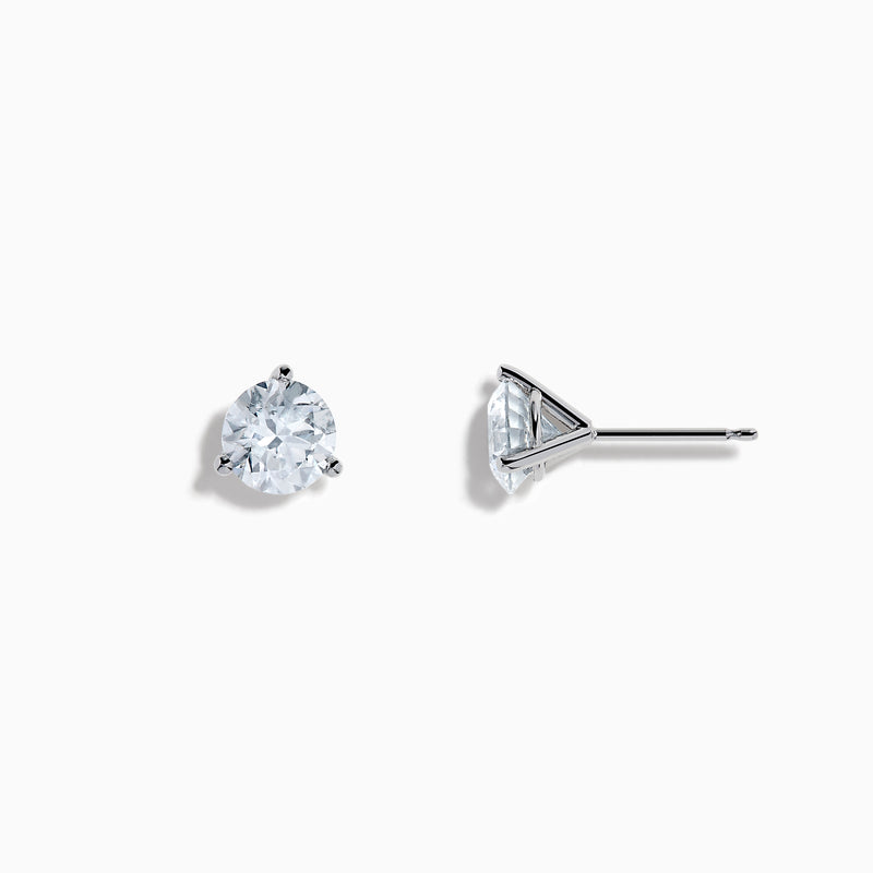 The Lab Grown Diamond Earring and Necklace Set in 14K White Gold features a heart-shaped diamond pendant on a silver necklace and matching heart-shaped diamond stud earrings, all showcased on a white background.