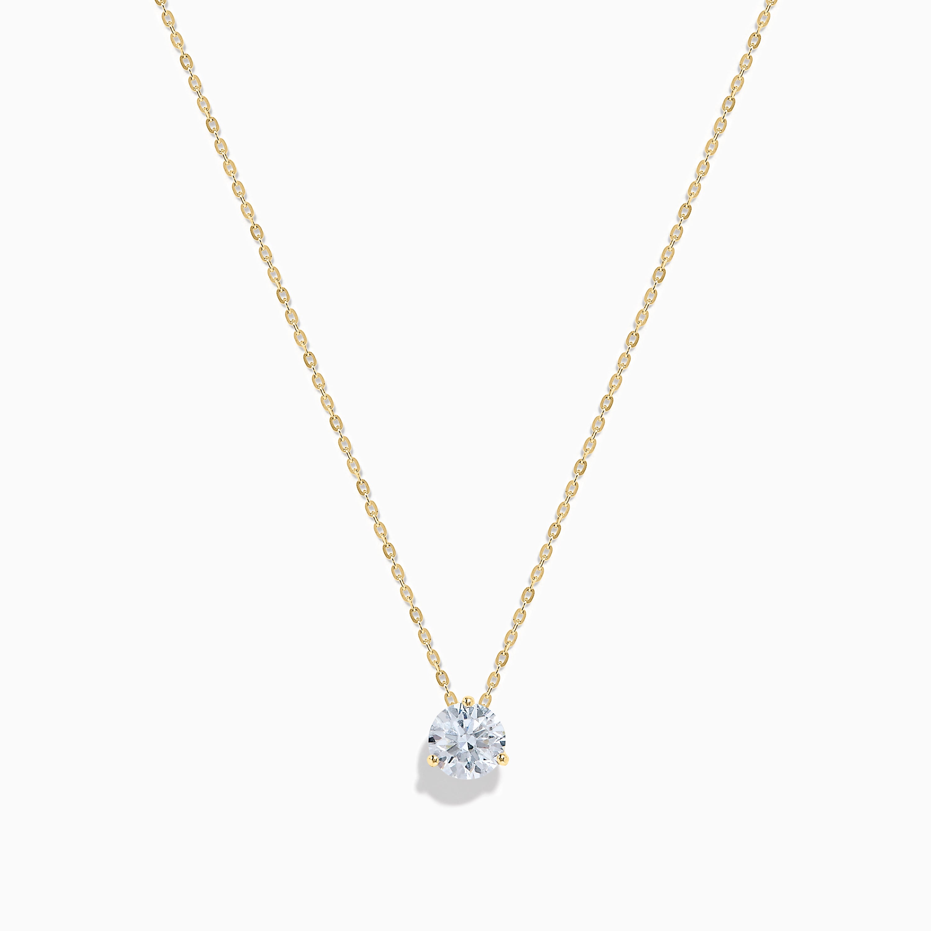 The Lab Grown Diamond Earring and Necklace Set in 14K Yellow Gold features a round diamond pendant and matching gold stud earrings, each showcasing a single round lab grown diamond, displayed on a white background.