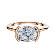 The 18K Rose Gold Bezel Half Bezel East/West Cathedral Dome 1.5mm Engagement Ring features a large oval-cut diamond in an east-west setting, secured by two curved prongs, shown against a plain white background.