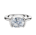 The 18K White Gold Bezel Half Bezel East/West Cathedral Dome 2.0mm Engagement Ring features a large, oval-cut diamond set horizontally in a modern bezel setting, displayed against a plain white background.