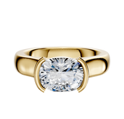 The 18K Yellow Gold Bezel Half Bezel East/West Cathedral Dome 4.0mm Engagement Ring showcases a prominent oval-cut clear gemstone set horizontally in a half bezel, shown against a plain white background.
