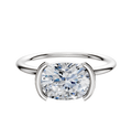 A 14K white gold engagement ring with a classic dome and 1.5mm band, featuring an east/west bezel half bezel setting, shown on a plain white background.