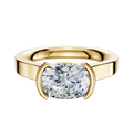 A 14K yellow gold engagement ring with a flat 3.0mm band and an east/west cathedral design in a modern half bezel setting.