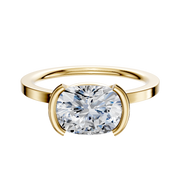 A 14K yellow gold Bezel Half Bezel East/West Classic Flat 1.5mm engagement ring is displayed on a plain light background.