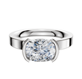The 14K White Gold Bezel Half Bezel East/West Classic Flat 3.0mm Engagement Ring features a modern, cushion-cut design with a minimalist bezel setting, shown on a plain white background.