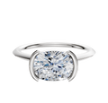 A platinum cathedral knife-edge engagement ring with a 1.5mm half bezel east/west setting shown against a white background.