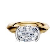 A 14K two tone engagement ring with a classic knife edge 3.0mm band and east/west half bezel setting, showcased on a plain white background.