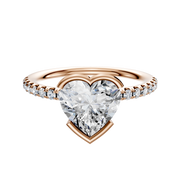 An 18K rose gold dome engagement ring featuring an east/west half bezel design with a single row of pave diamonds (2.5mm), creating a sparkling, elegant look.