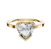 An 18K yellow gold bezel half bezel East/West classic flat 1.5mm engagement ring showcased against a plain white background.