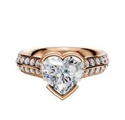 An 18K rose gold Cathedral Knife Edge engagement ring featuring a 2.5mm bezel-set center, east/west orientation, and a single row of pave diamonds along the band.