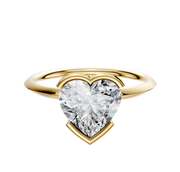 A 14K yellow gold bezel half bezel east/west classic knife edge 1.5mm engagement ring, showcased against a plain white background.