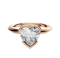 An 18K rose gold bezel half bezel east/west classic knife edge 2.0mm engagement ring, elegantly set against a plain white background.