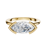 A 14K yellow gold cathedral dome engagement ring with a 2.0mm east/west half bezel setting, shown against a plain white background.