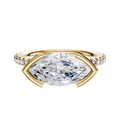 An 18K Yellow Gold East/West Classic Dome Engagement Ring featuring a 2.5mm band with a half bezel setting and one row of pave diamonds for added sparkle.