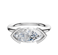 A 14K white gold bezel half bezel engagement ring with a classic dome 2.0mm band, featuring an east/west set center stone, displayed against a plain white background.