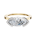 A 14K two tone bezel half bezel East/West cathedral flat 1.5mm engagement ring is shown, featuring a modern horizontal setting and displayed on a simple light background.