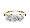 An 18K two-tone bezel half bezel East/West classic flat 2.0mm engagement ring is set with a large, horizontally placed marquise-cut diamond in a modern, open setting against a plain white background.