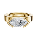 The 18K Yellow Gold Bezel Half Bezel East/West Classic Flat 4.0mm Engagement Ring showcases a large marquise diamond set horizontally in a sleek, modern half bezel setting.