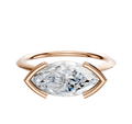 The 18K Rose Gold Bezel Half Bezel East/West Cathedral Knife Edge 1.5mm Engagement Ring is shown against a white background, featuring a modern, geometric setting in rose gold.