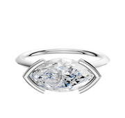 A Platinum Bezel Half Bezel East/West Cathedral Knife Edge 1.5mm Engagement Ring featuring a large, oval-cut clear diamond is displayed against a plain white background.