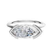 A Platinum Bezel Half Bezel East/West Classic Knife Edge 1.5mm Engagement Ring with a large gemstone in a modern east/west setting is displayed against a plain white background.