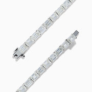 The Platinum Emerald Cut 14.47 Ct. Diamond Tennis Bracelet features a continuous row of prong-set, emerald cut diamonds displayed on a plain white background.