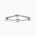 The 18K Two Tone Gold Yellow and White Diamond Bracelet features alternating round white stones and three central yellow diamond clusters, each encircled by white diamonds, secured with a reliable clasp.