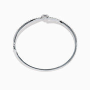 The Star Lab Grown Diamond Connect Bangle in 18K White Gold features a central round lab-grown diamond and a band set with small diamonds, all in an elegantly curved design, displayed on a white background.