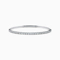 The 14K White Gold Flexible Diamond Bracelet features a slim, elegant design with a single row of sparkling diamonds set around its flexible band, shown against a white background.