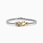 The Signature 14K Two Tone Gold Diamond and Emerald Panther Bangle features a silver mesh bracelet and a panther-shaped clasp with diamond accents and emerald eyes, shown on a white background.
