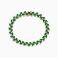 The Brasilica 14K Yellow Gold Emerald and Diamond Bracelet showcases alternating marquise-shaped emeralds and small round diamonds in a leaf-inspired pattern, forming a complete oval design.