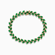 The Brasilica 14K Yellow Gold Emerald and Diamond Bracelet showcases alternating marquise-shaped emeralds and small round diamonds in a leaf-inspired pattern, forming a complete oval design.