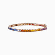 The Watercolors 14K Rose Gold Multi Sapphire Bracelet features square-cut sapphires in a gradient rainbow design, elegantly set in a thin rose gold band and shown against a white background.