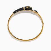 The Signature 14K Yellow Gold Black Diamond Panther Bangle showcases a black panther head with green eyes and a sparkling loop clasp set with small clear stones.