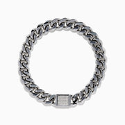 The Men's Sterling Silver Diamond Cuban Link Bracelet features a thick Cuban link chain and a rectangular clasp set with small diamonds, displayed in a circular shape on a white background.