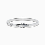The 925 Sterling Silver and Diamond Bangle features a sleek design with repeating square sections, each set with sparkling diamond-like clear stones.
