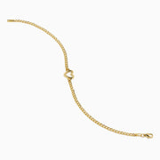 The 14K Yellow Gold Heart Curb Chain Bracelet features a delicate heart-shaped charm on a classic curb chain, shown on a plain white background.