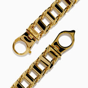 The Mens 14K Yellow Gold Hollow Railroad Bracelet features rectangular links and a lobster clasp, shown on a white background—a refined chain bracelet ideal for everyday elegance.