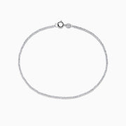The 14K White Gold Bead Bracelet features small, evenly spaced round beads on a fine chain and includes a lobster clasp closure, displayed in a circular shape.